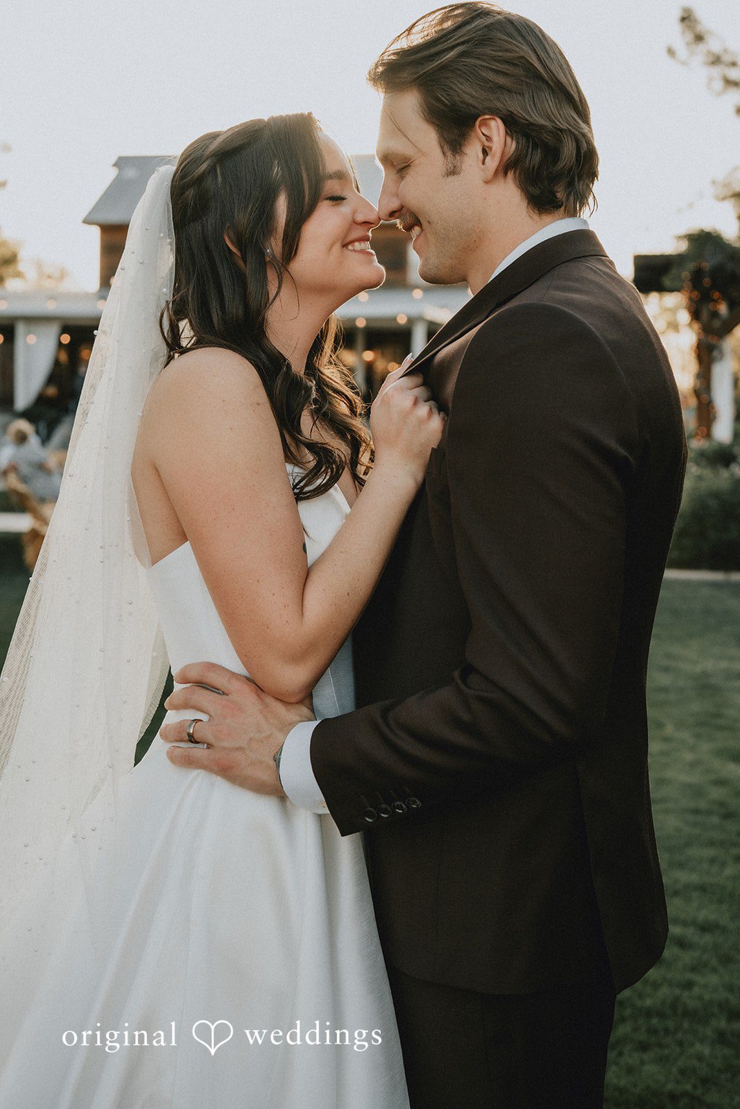 Close up portrait of the bride and groom smiling