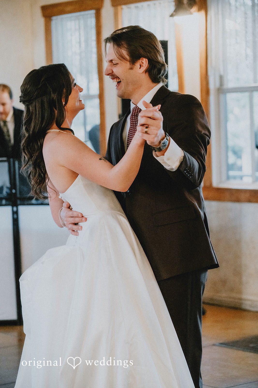 Bride and groom sharing their first dance together during the wedding reception at Shenandoah Mill