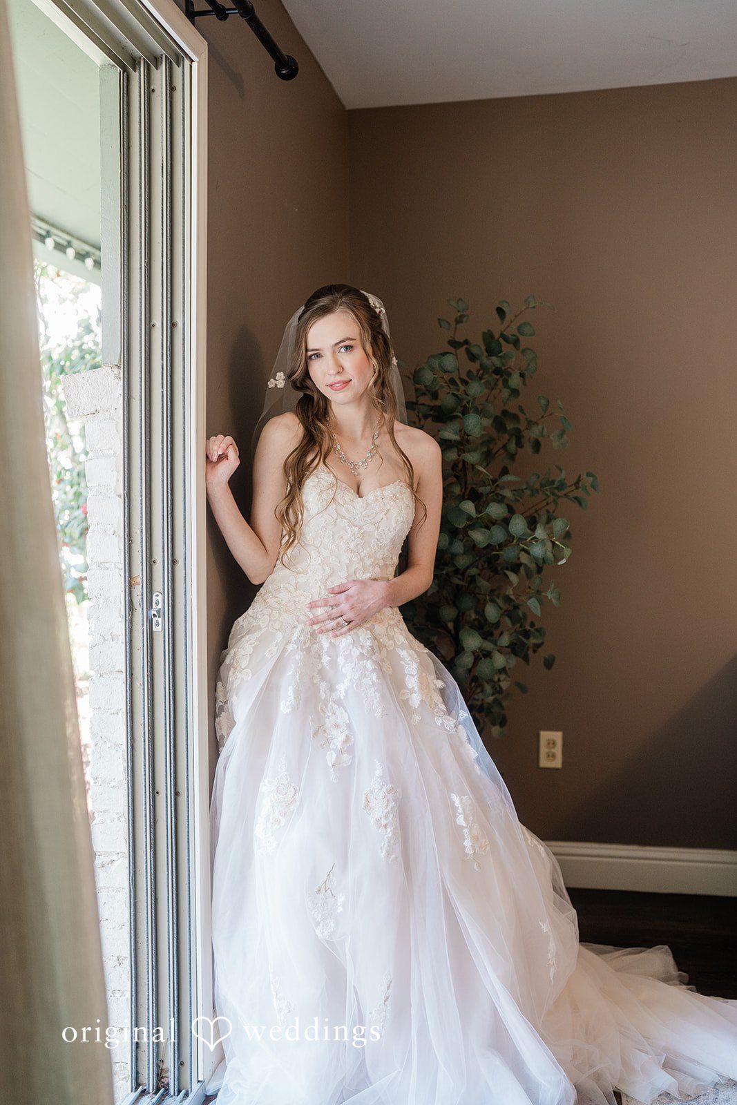 Our Houston wedding photographers took a stunning portrait of the bride in the bridal suite