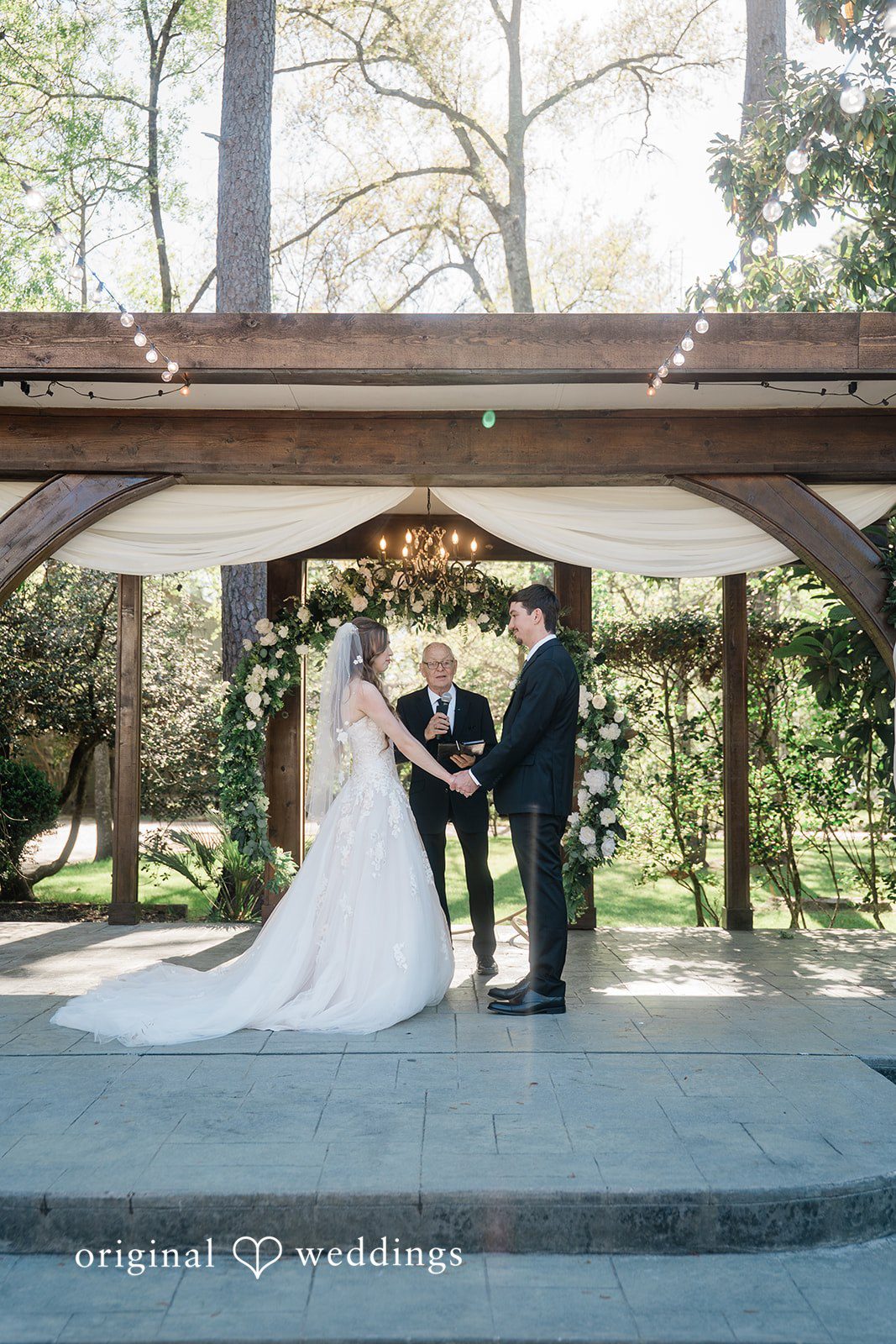 The priest joins the couple together