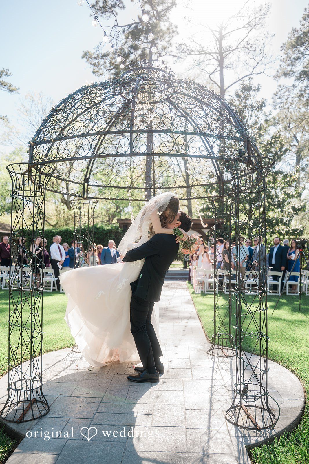 The couple shares a kiss