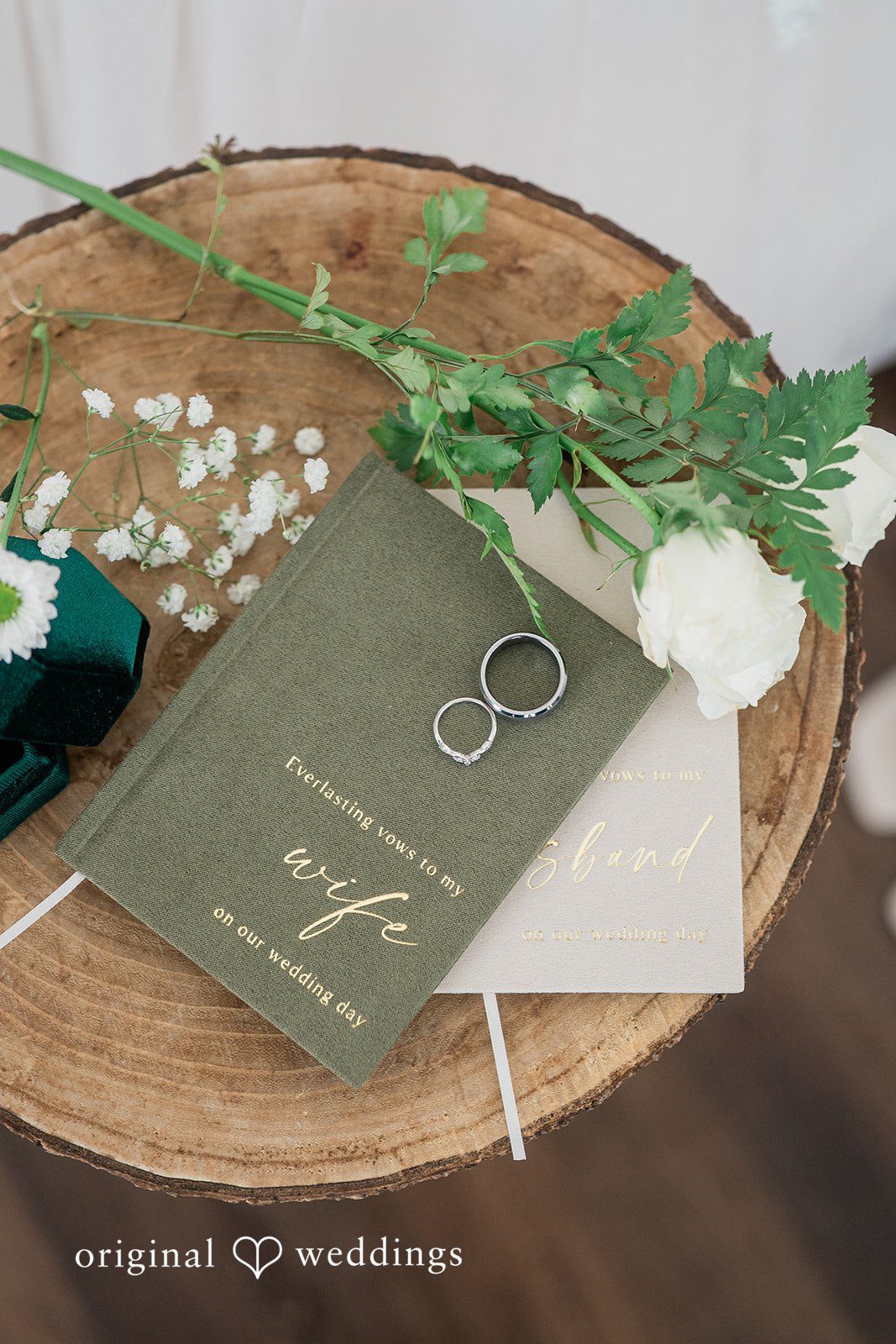 A detail shot of the wedding rings, bouquet, etc