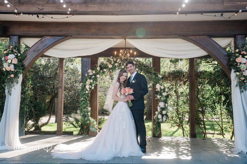Our Houston wedding photographers captured the couple by the arbor at Shirley Acres