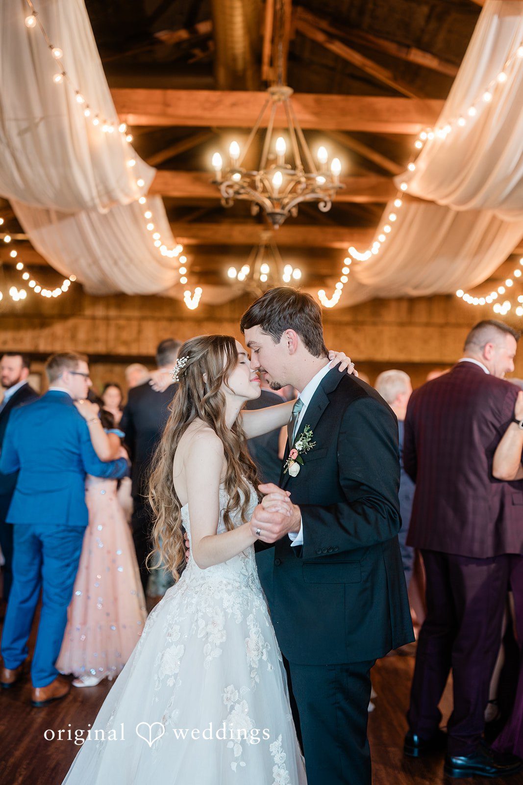 The couple takes a romantic dance