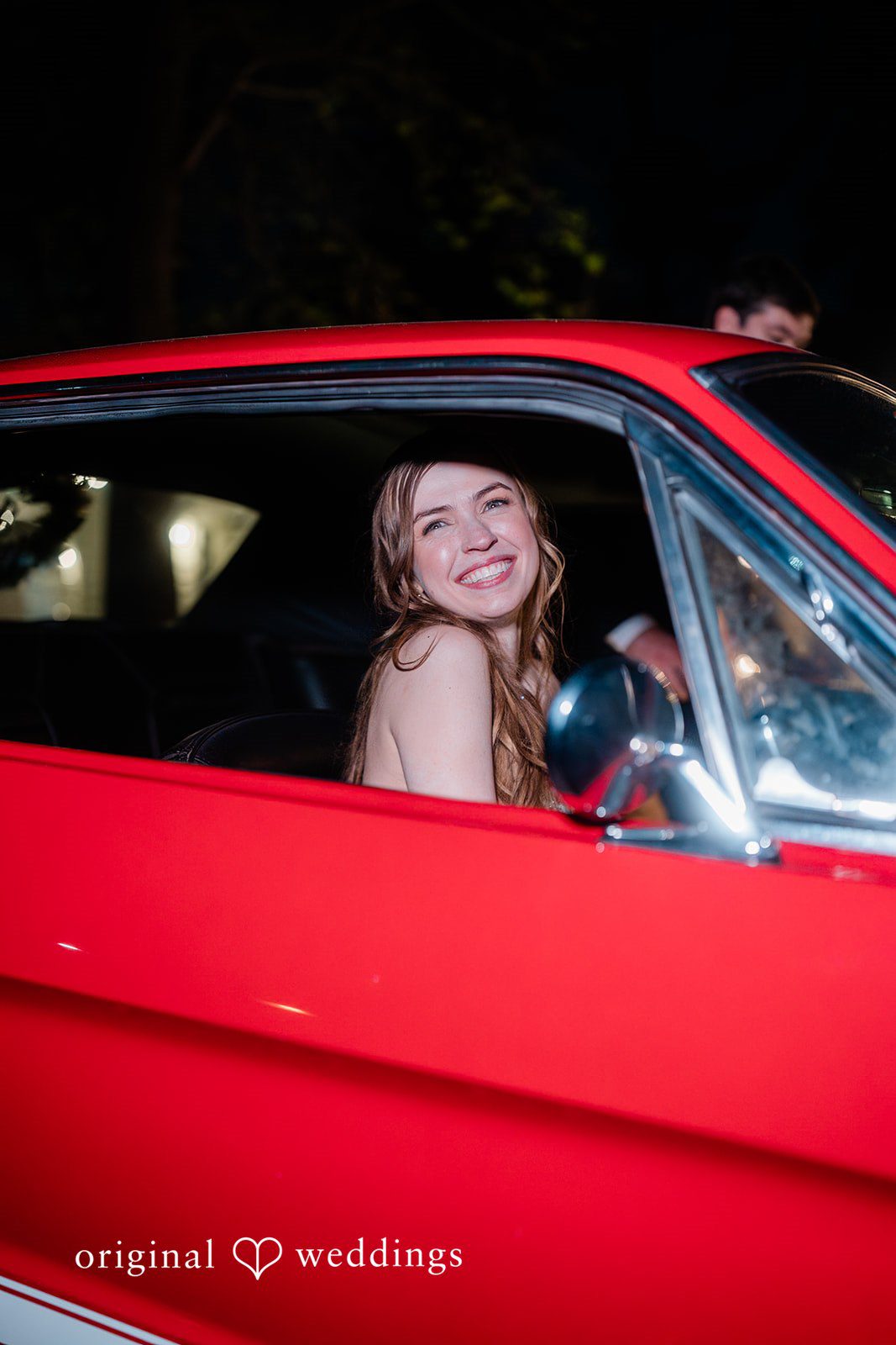 The couple about to happily retire in their red car
