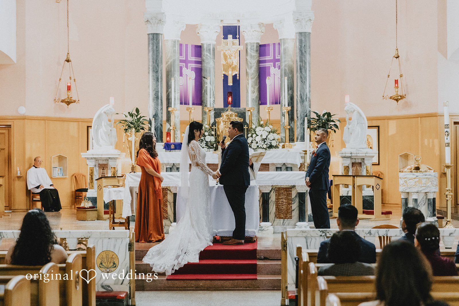 Couple exchanging vows while holding hands