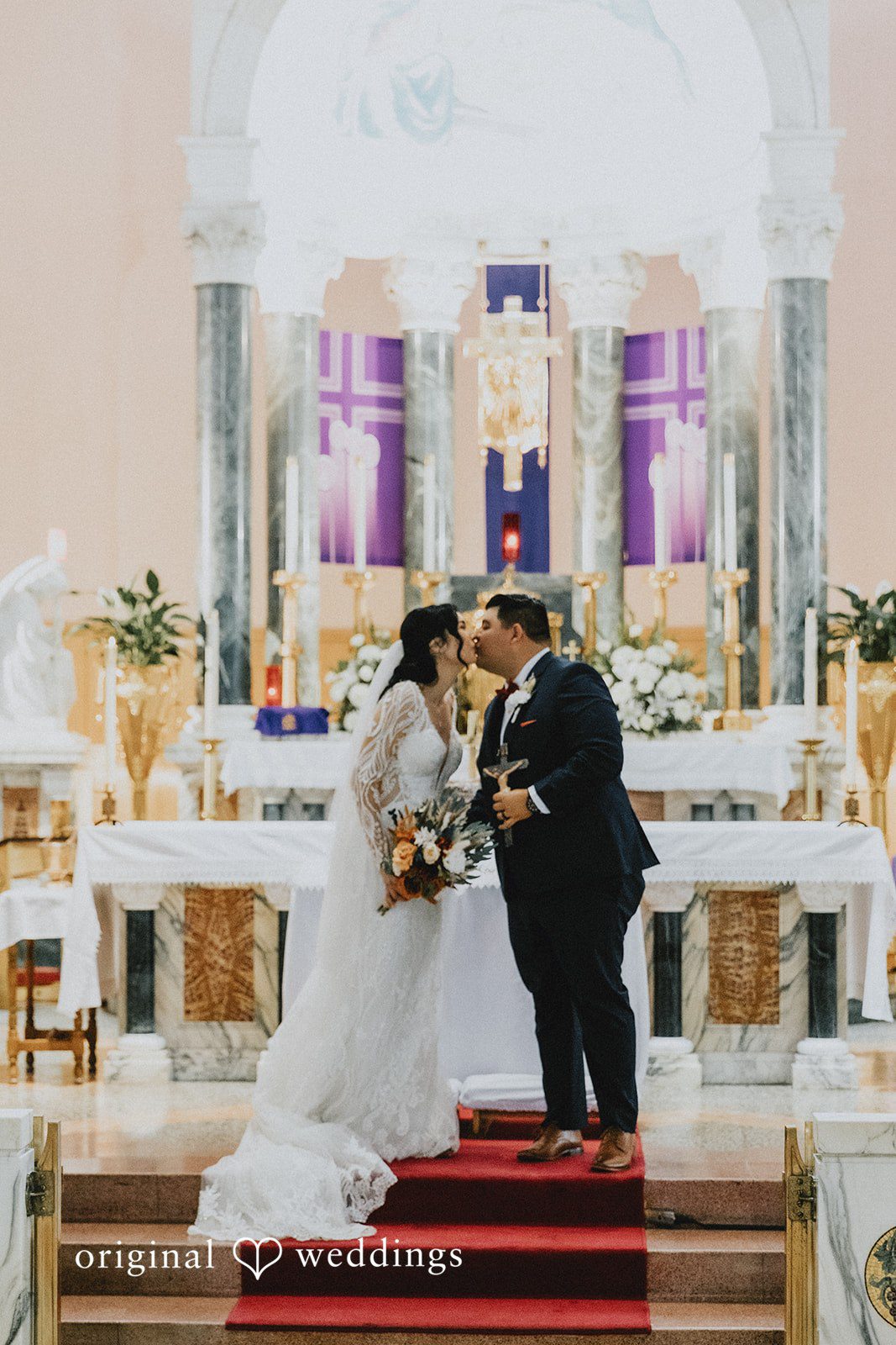 Romantic kiss moment of couple during ceremony at Sierra La Verne