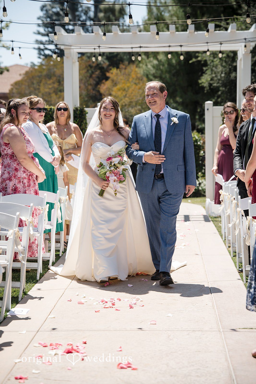 Bride entering the ceremony area with her father