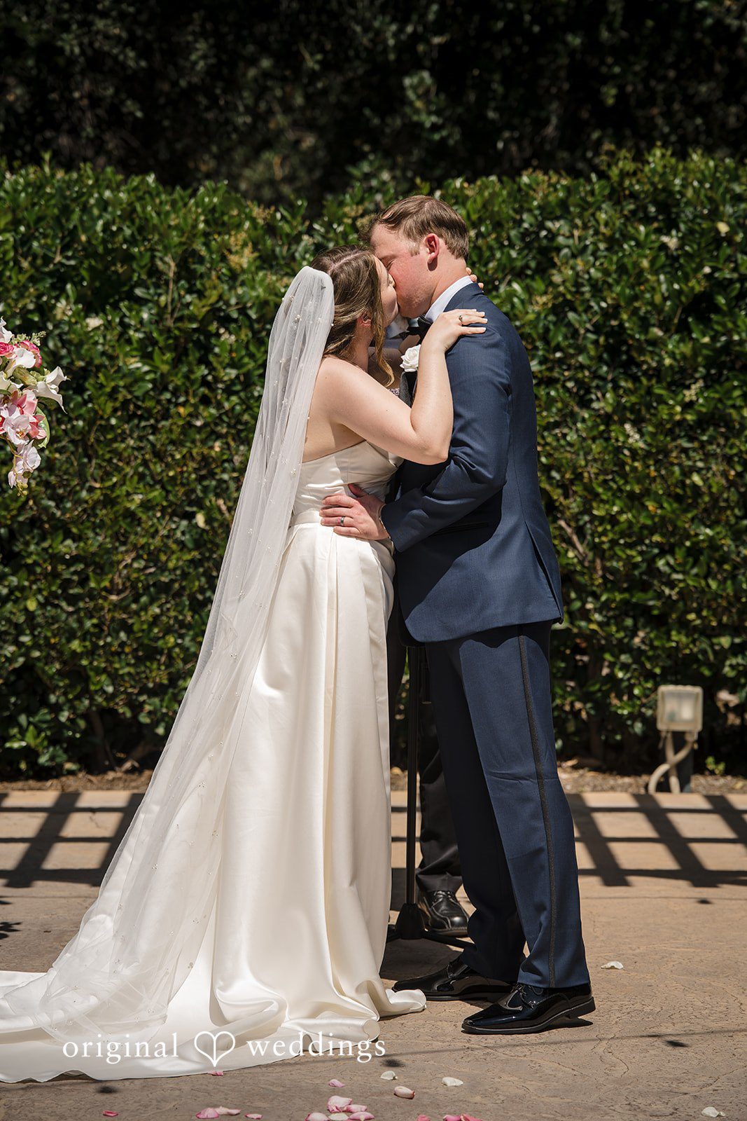 Couple sharing their first kiss after exchanging vows