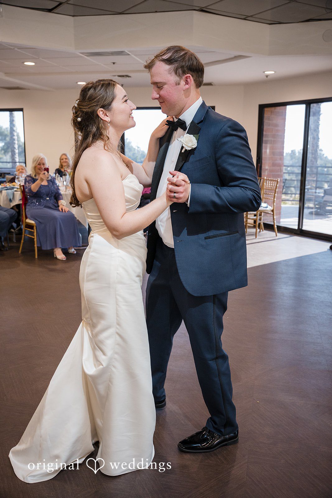 Bride and groom sharing their first dance at the reception