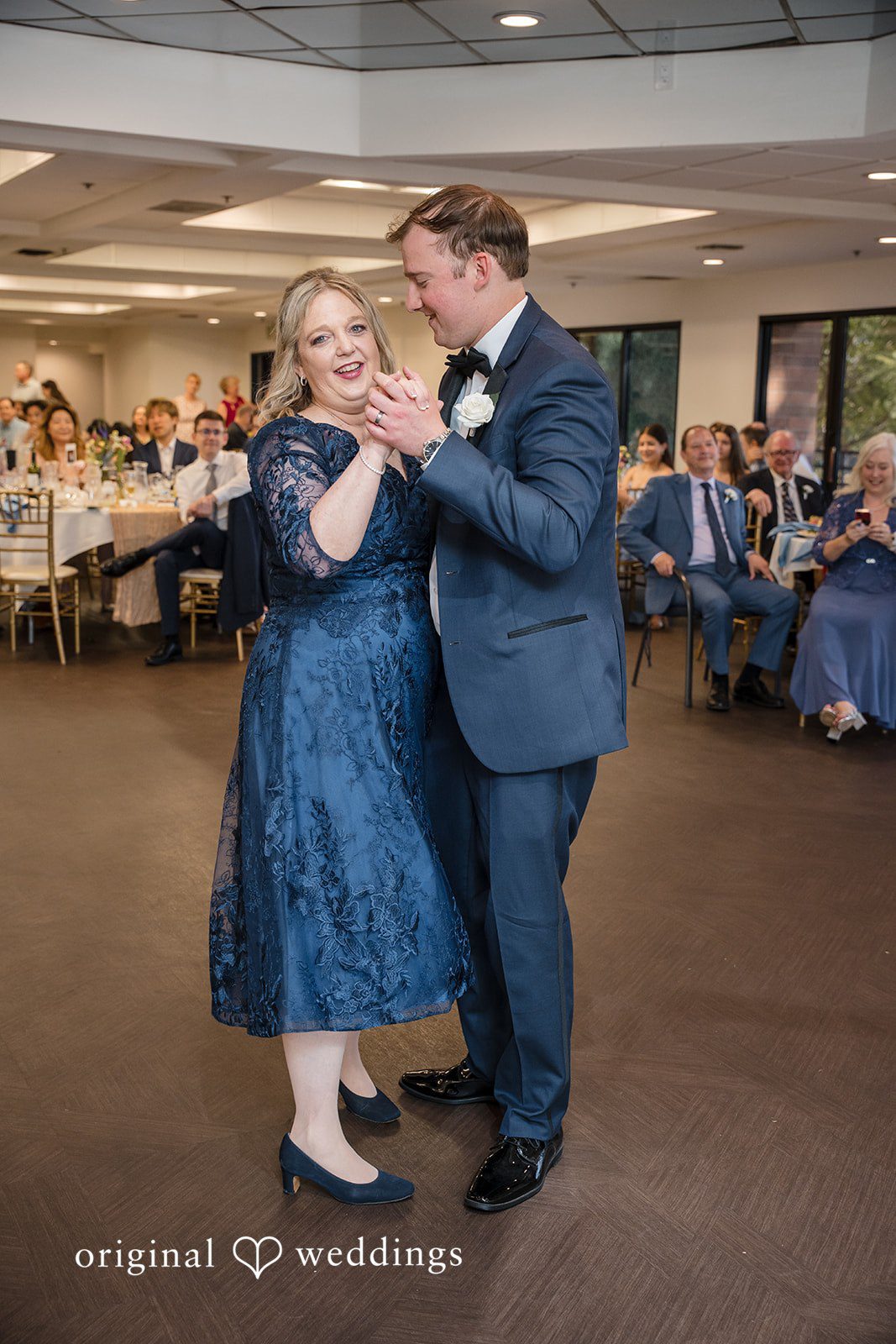 Groom dancing with his mother during the wedding celebration