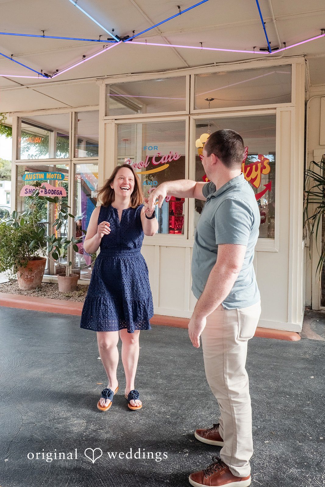 Eric + Kimberly Engaged couple laughing together outside