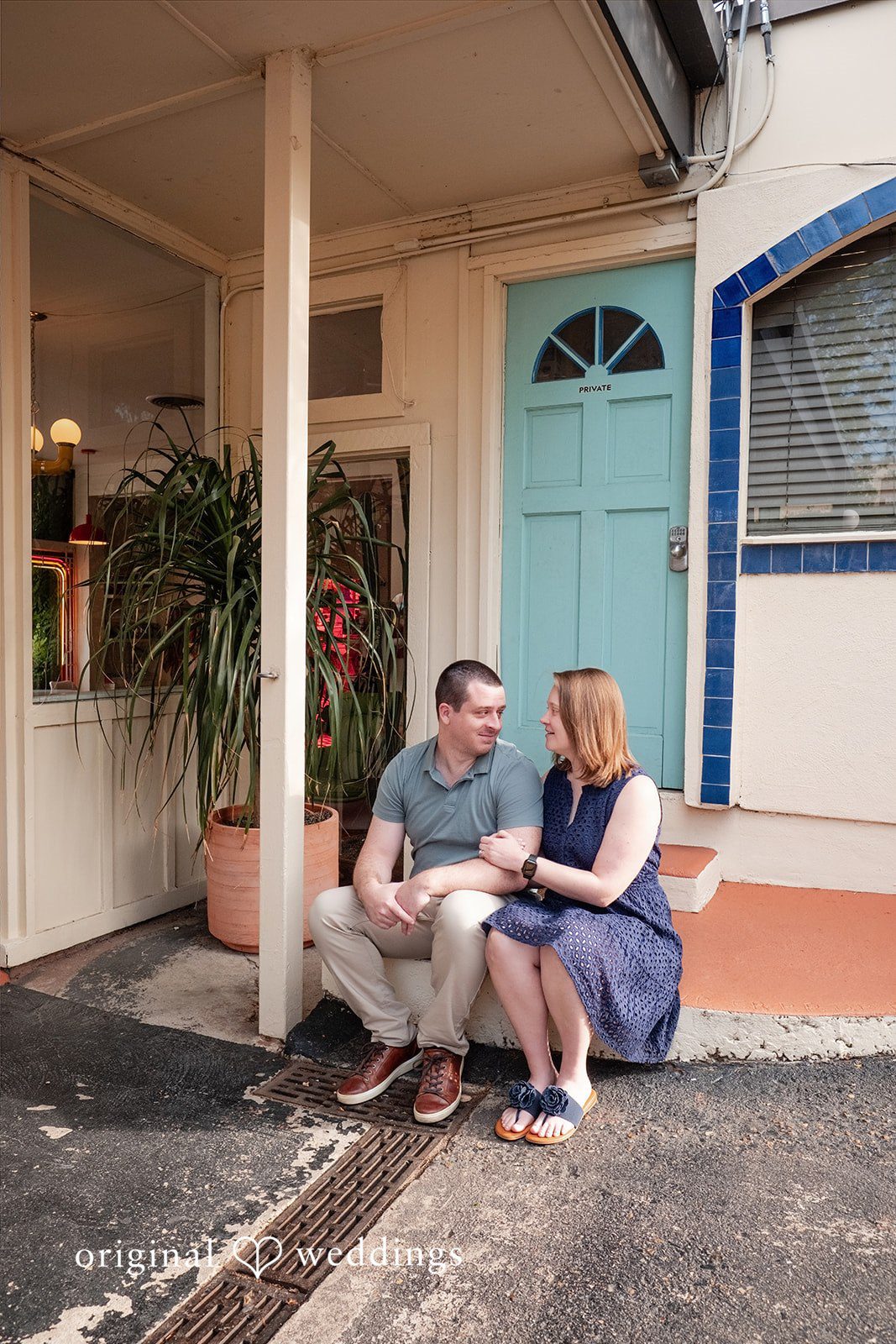 Eric + Kimberly Engaged couple sitting together outside at South Congress