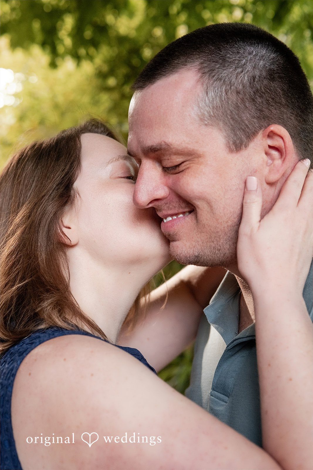 Eric + Kimberly Couple sharing an intimate kiss during their outdoor engagement session at South Congress