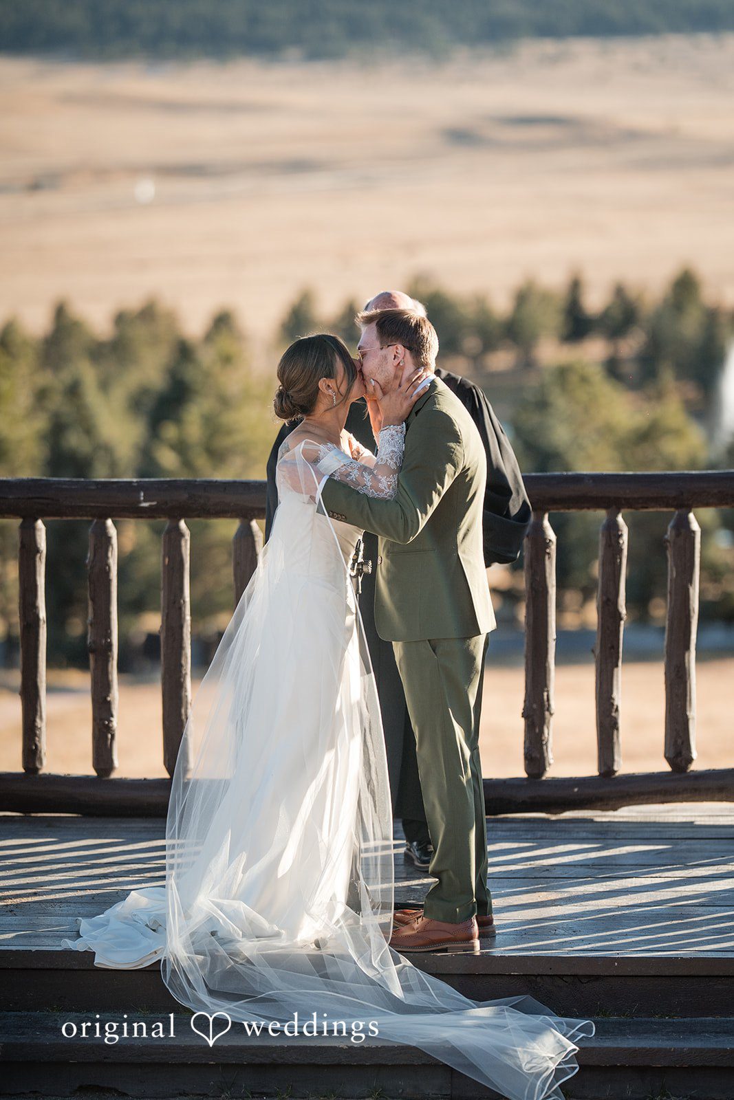 Couple sharing their first kiss after exchanging vows