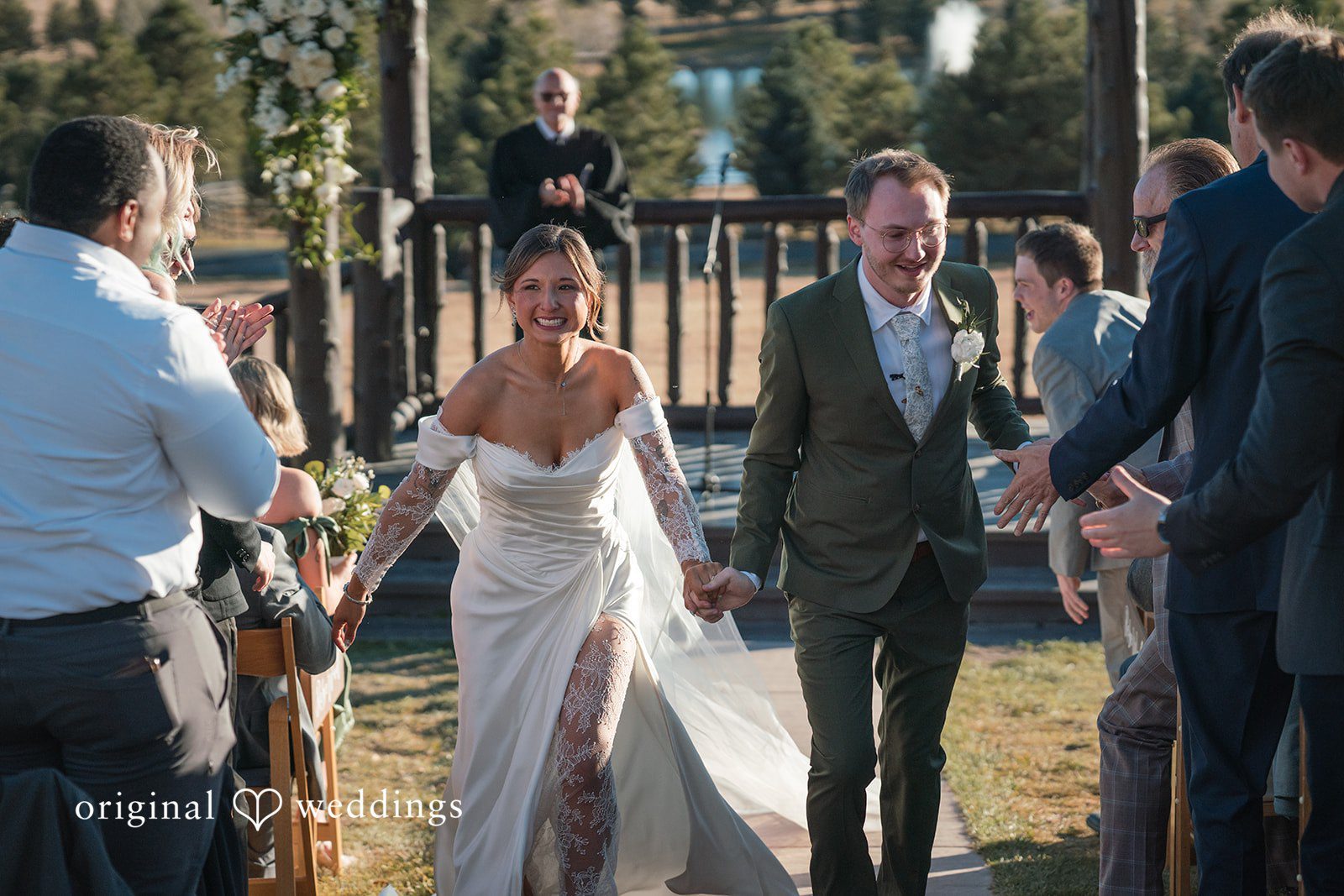 Bride and groom walking hand in hand after the ceremony