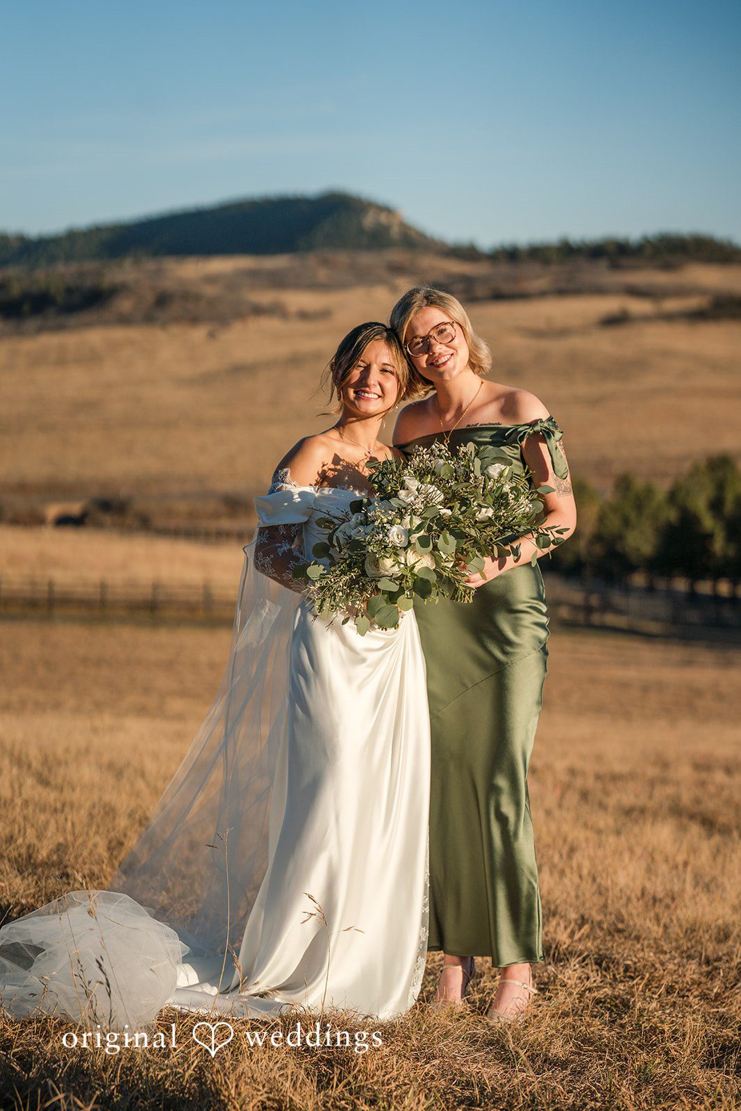 Bride posing with a friend before the ceremony