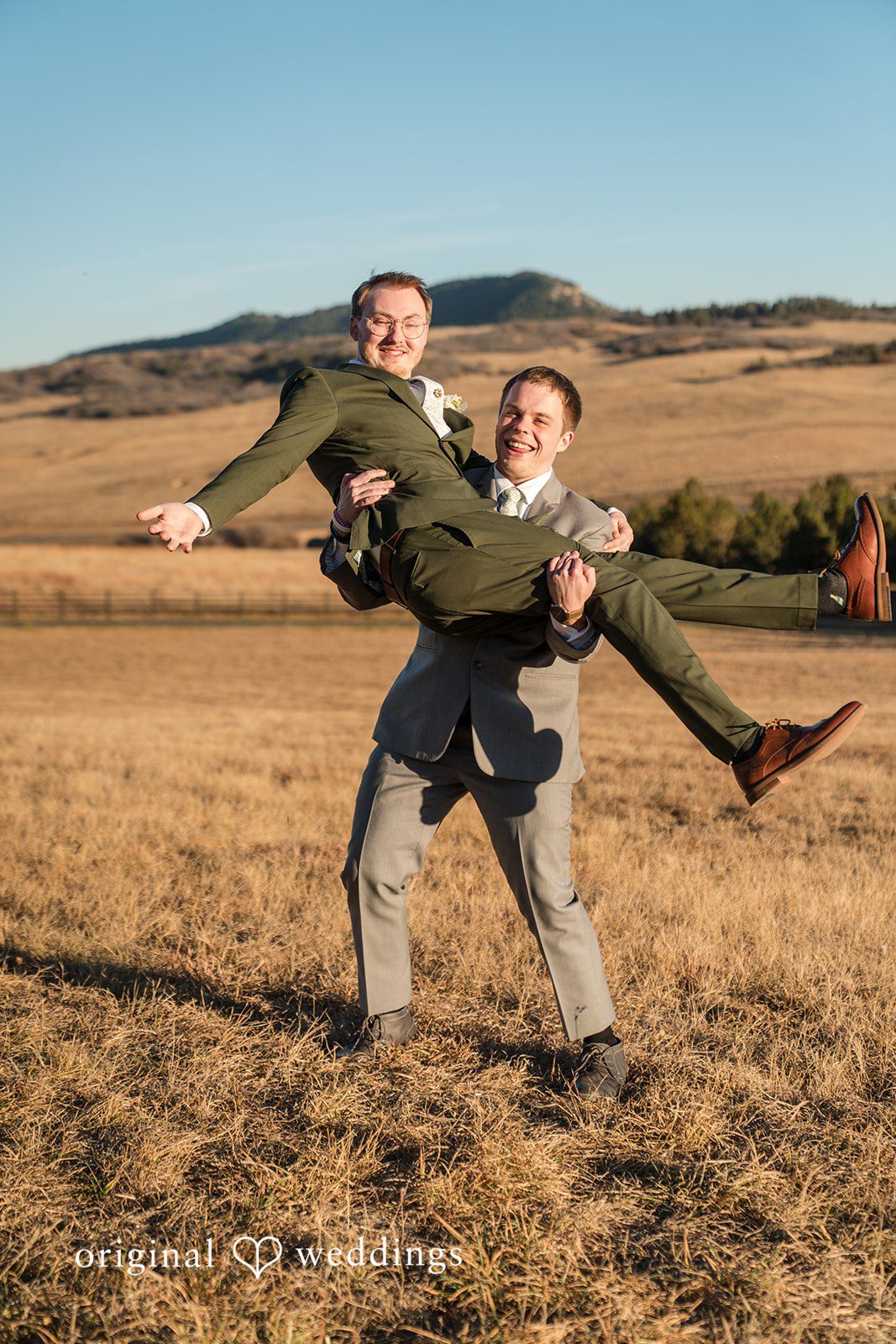 Groom posing with a friend before the ceremony