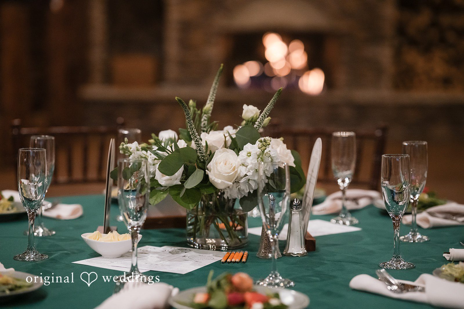 Detailed reception table decor with candles and floral arrangements
