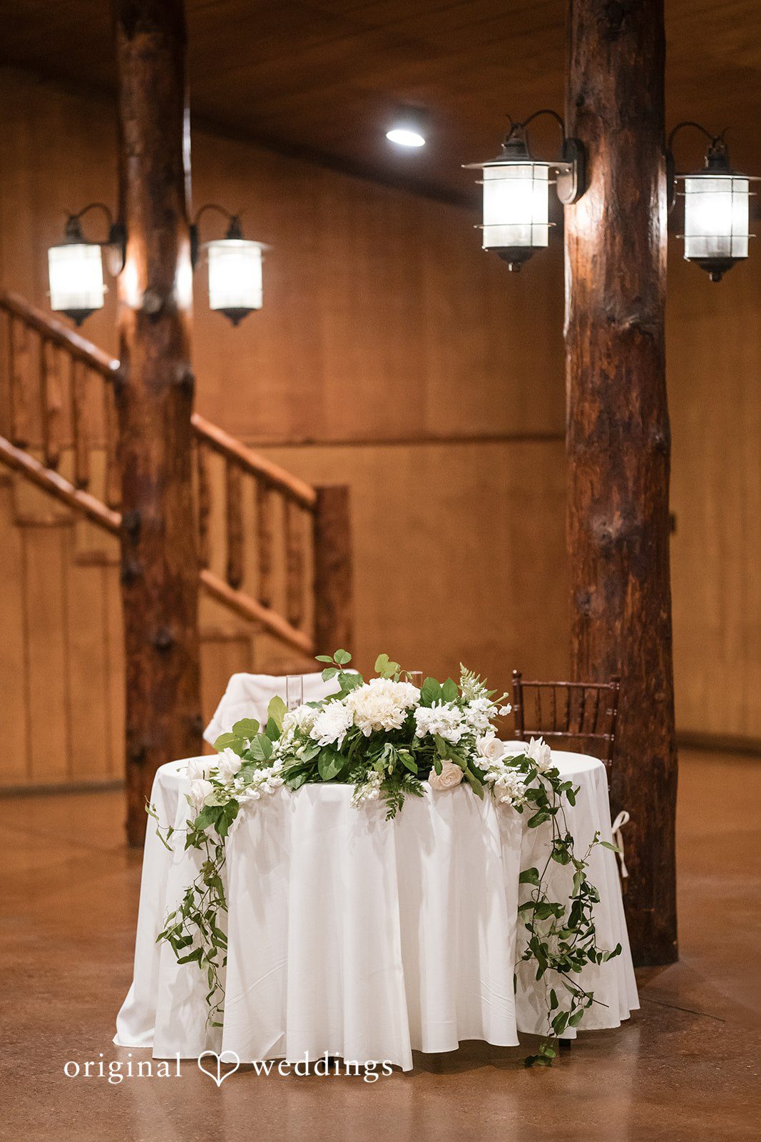 Wide view of the sweetheart table at the wedding reception