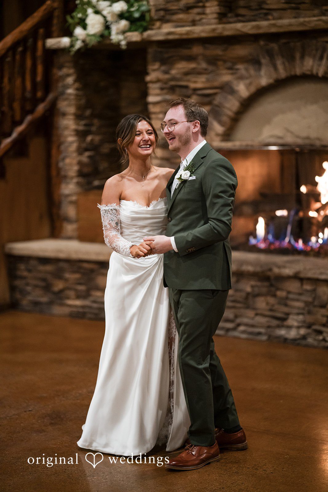 Fun candid moment of the bride and groom at the reception