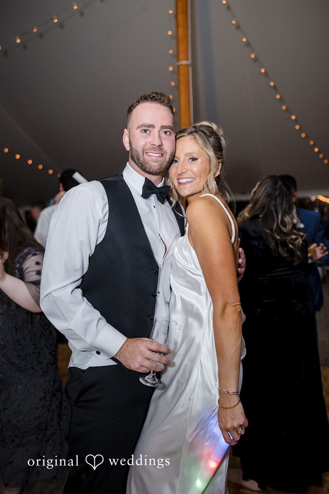 Laura + Nicholas Bride and groom smiling together during wedding reception celebration