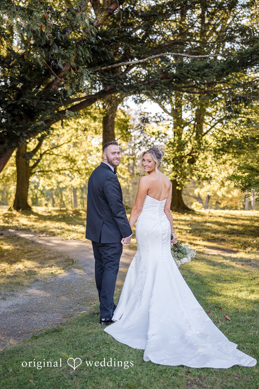 Laura + Nicholas Stunning newlywed portrait surrounded by elegant outdoor scenery