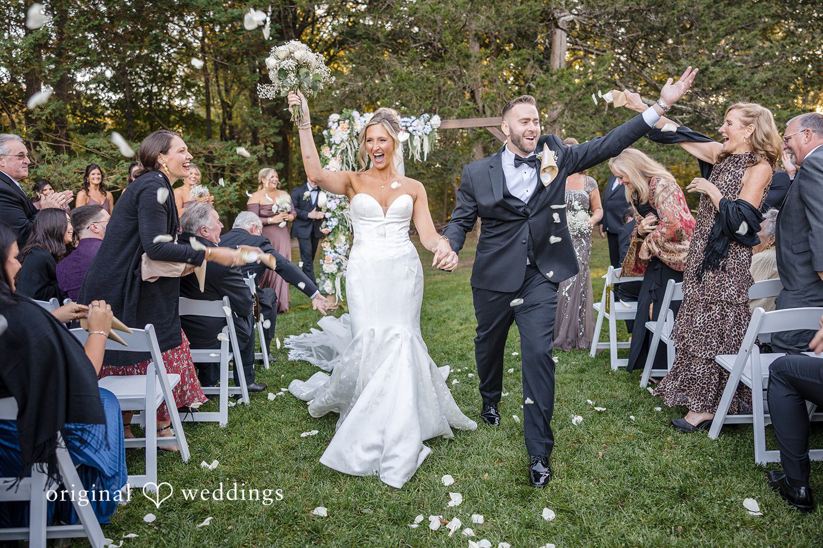 Laura + Nicholas Boston Wedding Photographers by Original Weddings capturing bride and groom walking together after ceremony at Stevens Estate at Osgood Hill