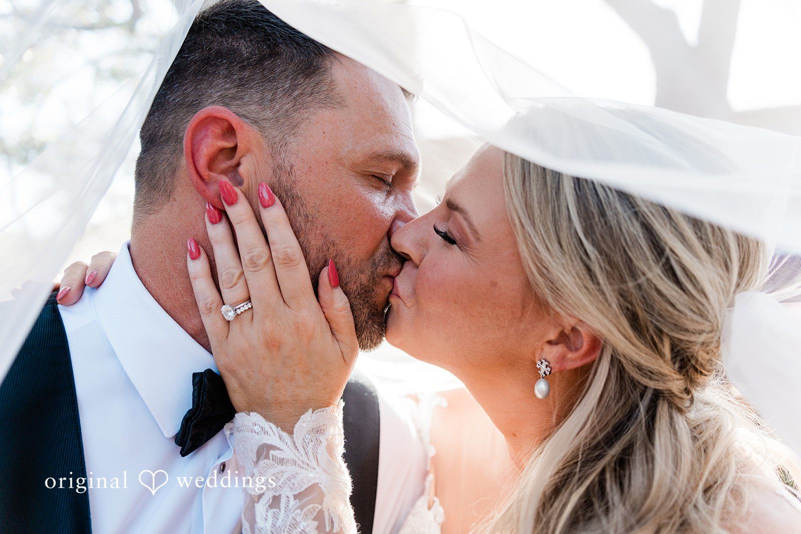 A romantic headshot portrait of the couple