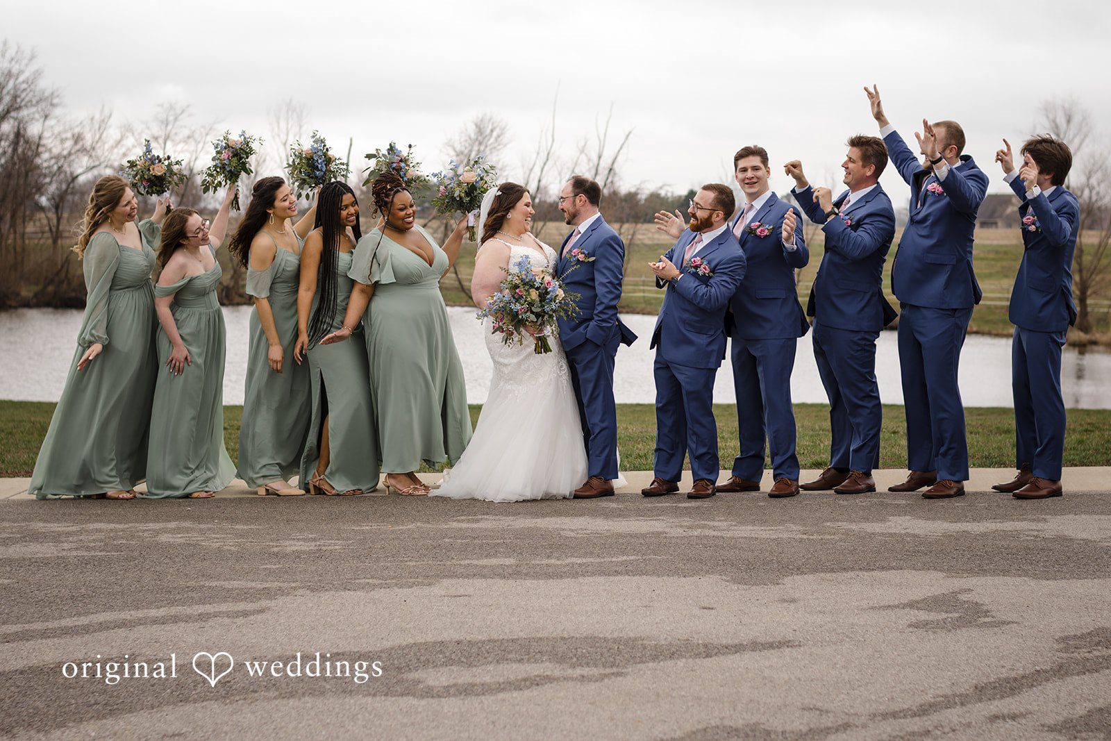 Katrena + Ryan Bride and groom posing with bridesmaids and groomsmen together