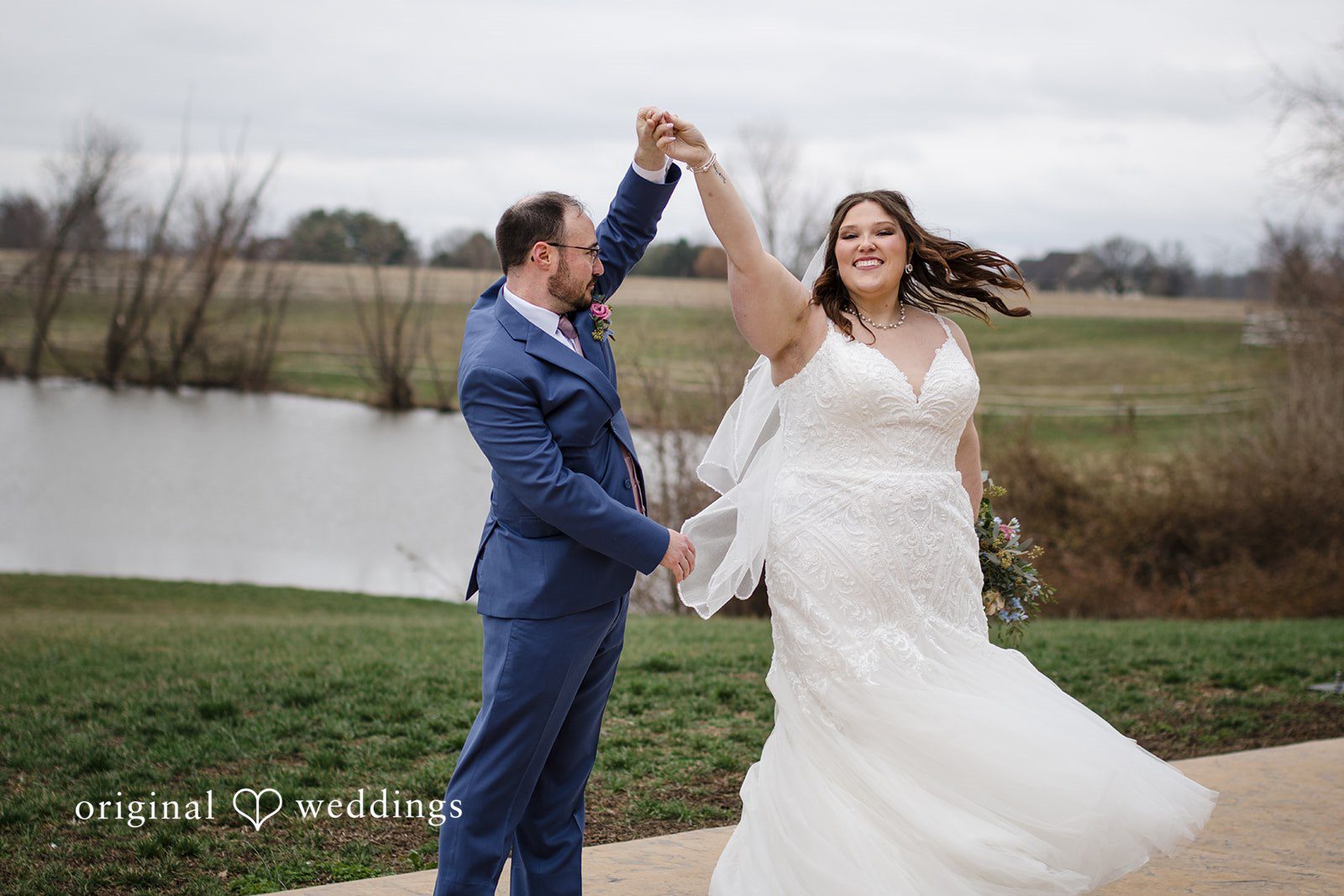 Katrena + Ryan Bride twirling the groom during outdoor wedding portraits