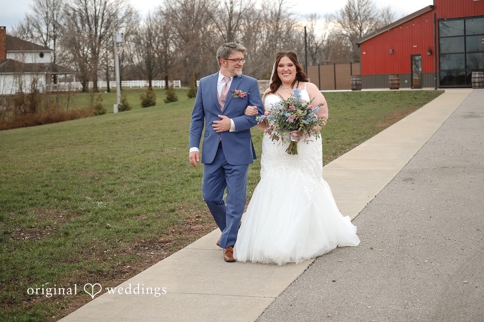 Katrena + Ryan Bride walking with her father toward the ceremony area