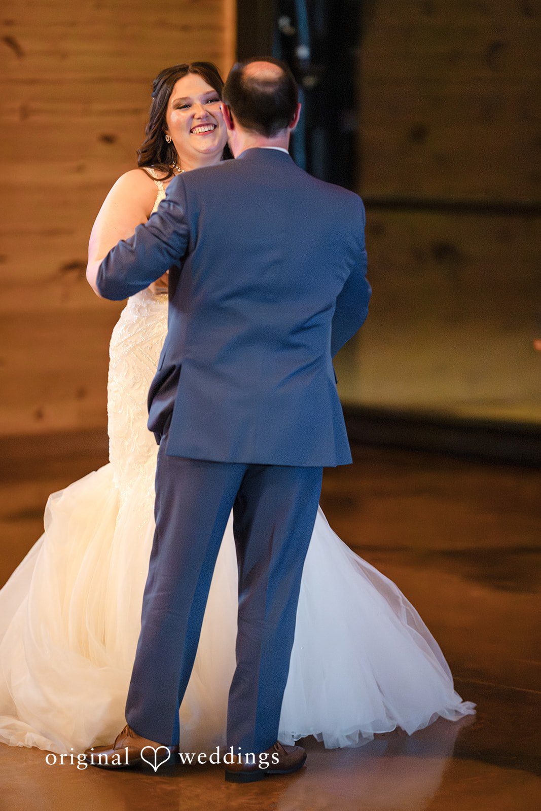 Katrena + Ryan Couple sharing a kiss during the reception celebration