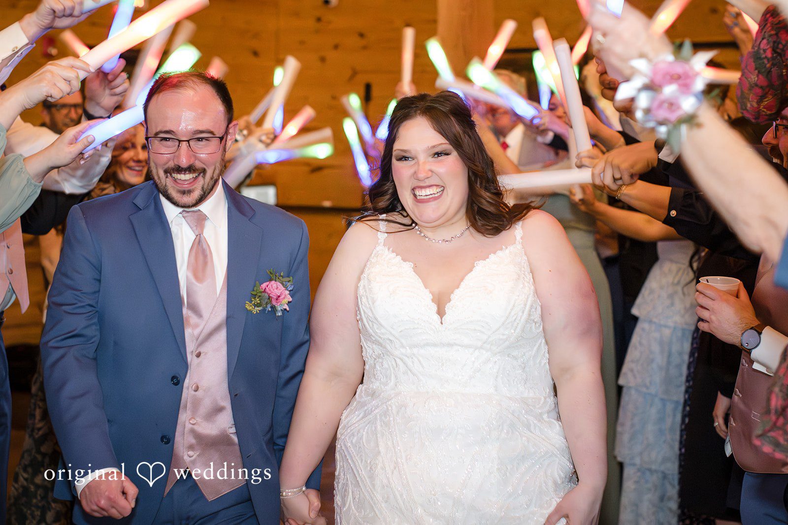 Katrena + Ryan Newlyweds walking hand in hand after the ceremony