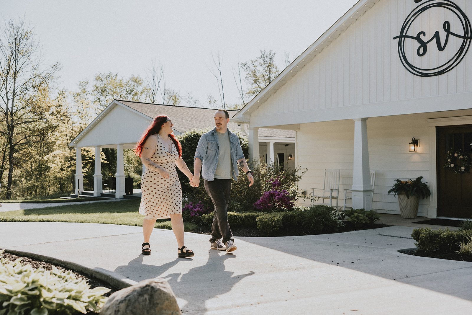 The couple takes a walk through the venue