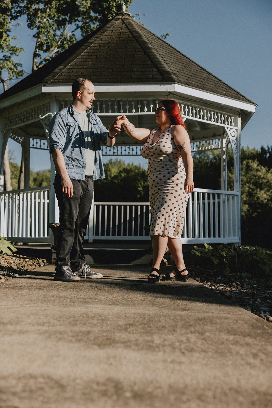 A portrait of the couple by the gazebo