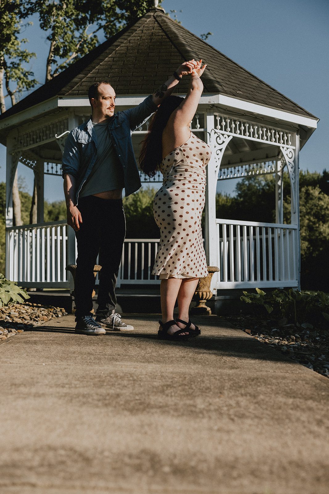 A fun portrait of the couple by the gazebo