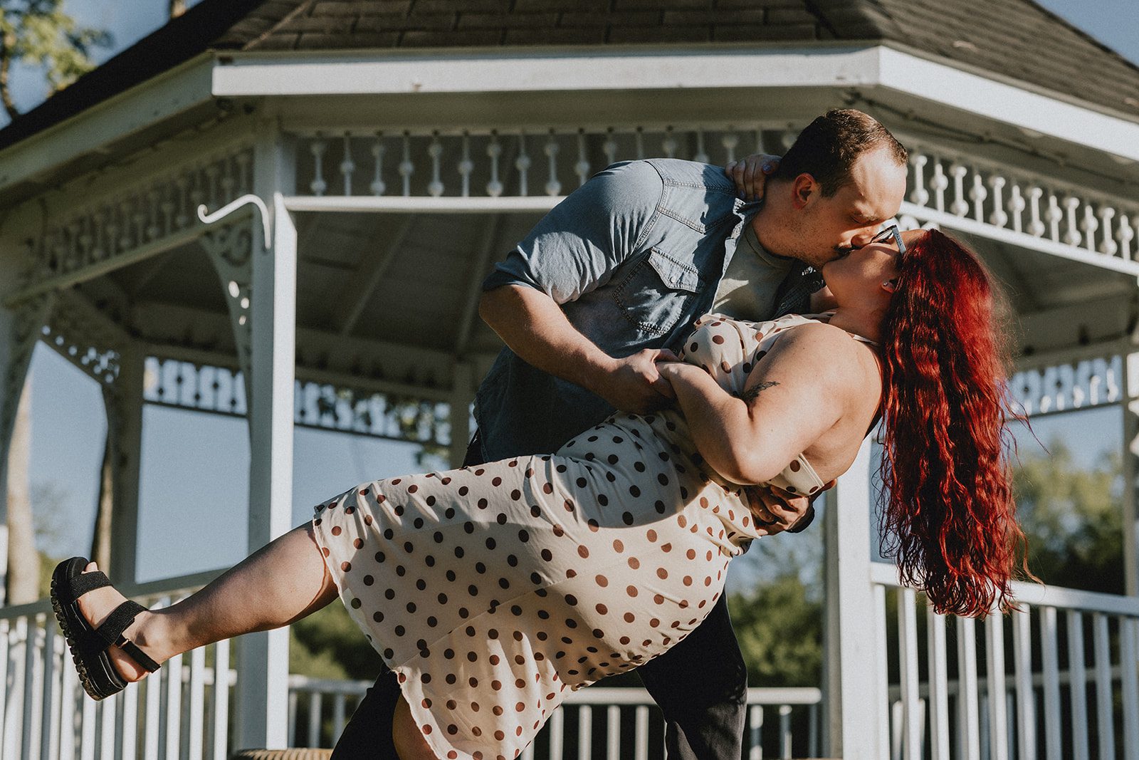 Our Cleveland engagement photographers captured a romantic portrait of the couple framed by the beauty of the gazebo at Sun Valley
