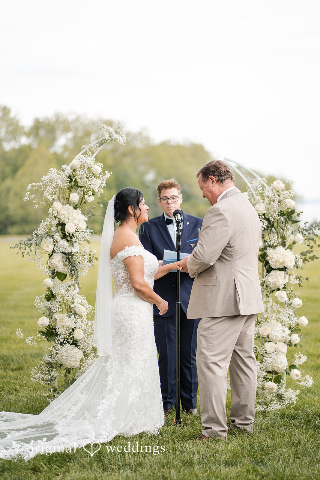 Romantic wedding ring exchange moment at Swan Harbor Farm