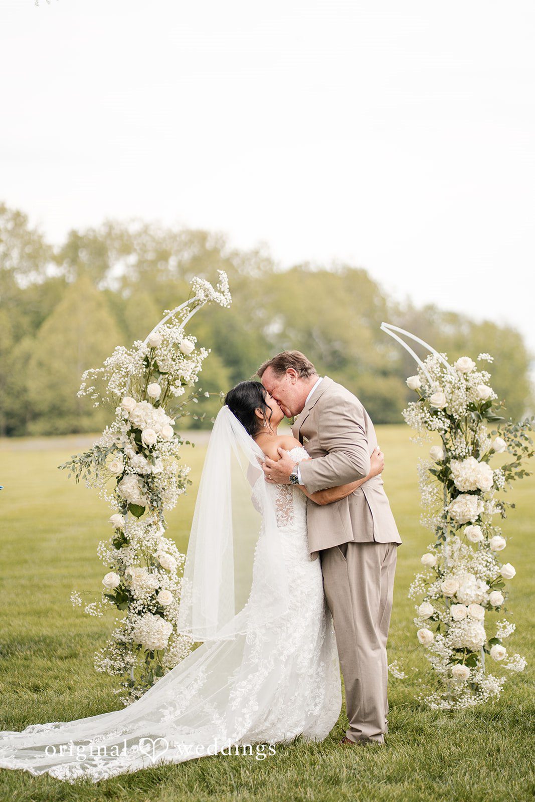 Romantic bride and groom kiss portrait at Swan Harbor Farm
