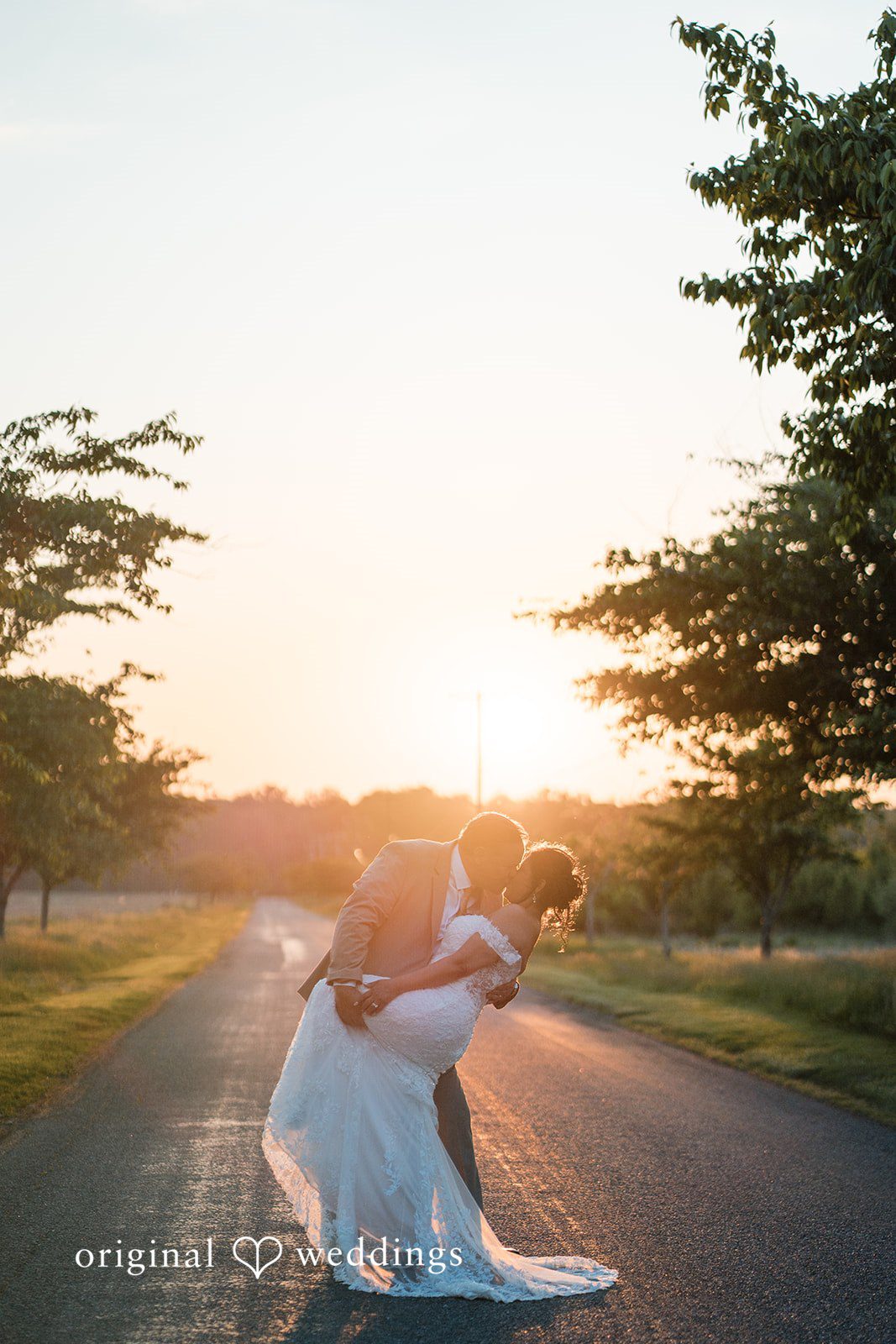 Elegant bride and groom kiss moment at Swan Harbor Farm