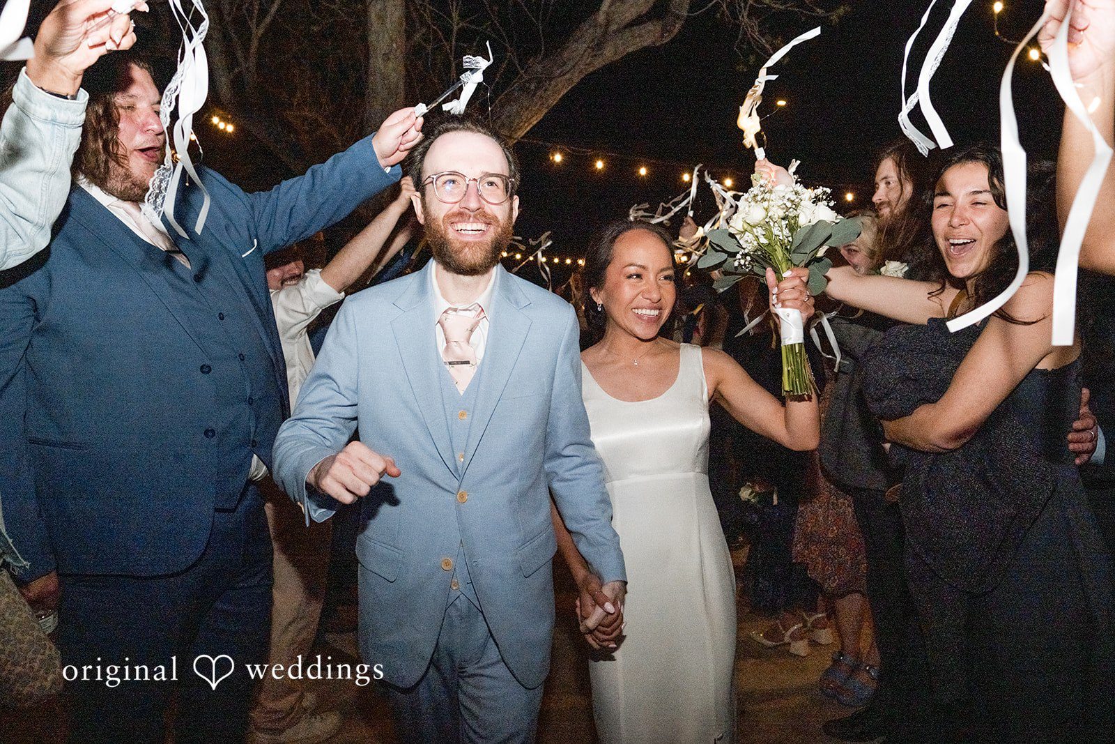 Dana + Daniel Newlyweds being sent off by guests at the end of the night