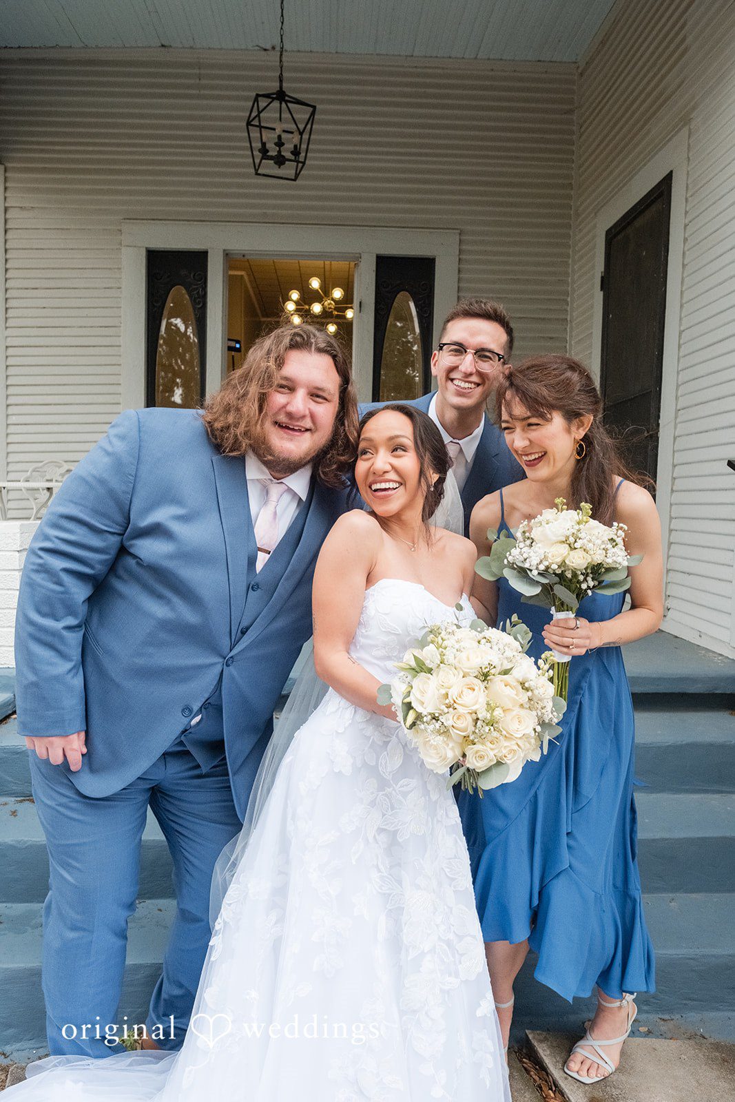 Dana + Daniel Bride with wedding party in a joyful group portrait