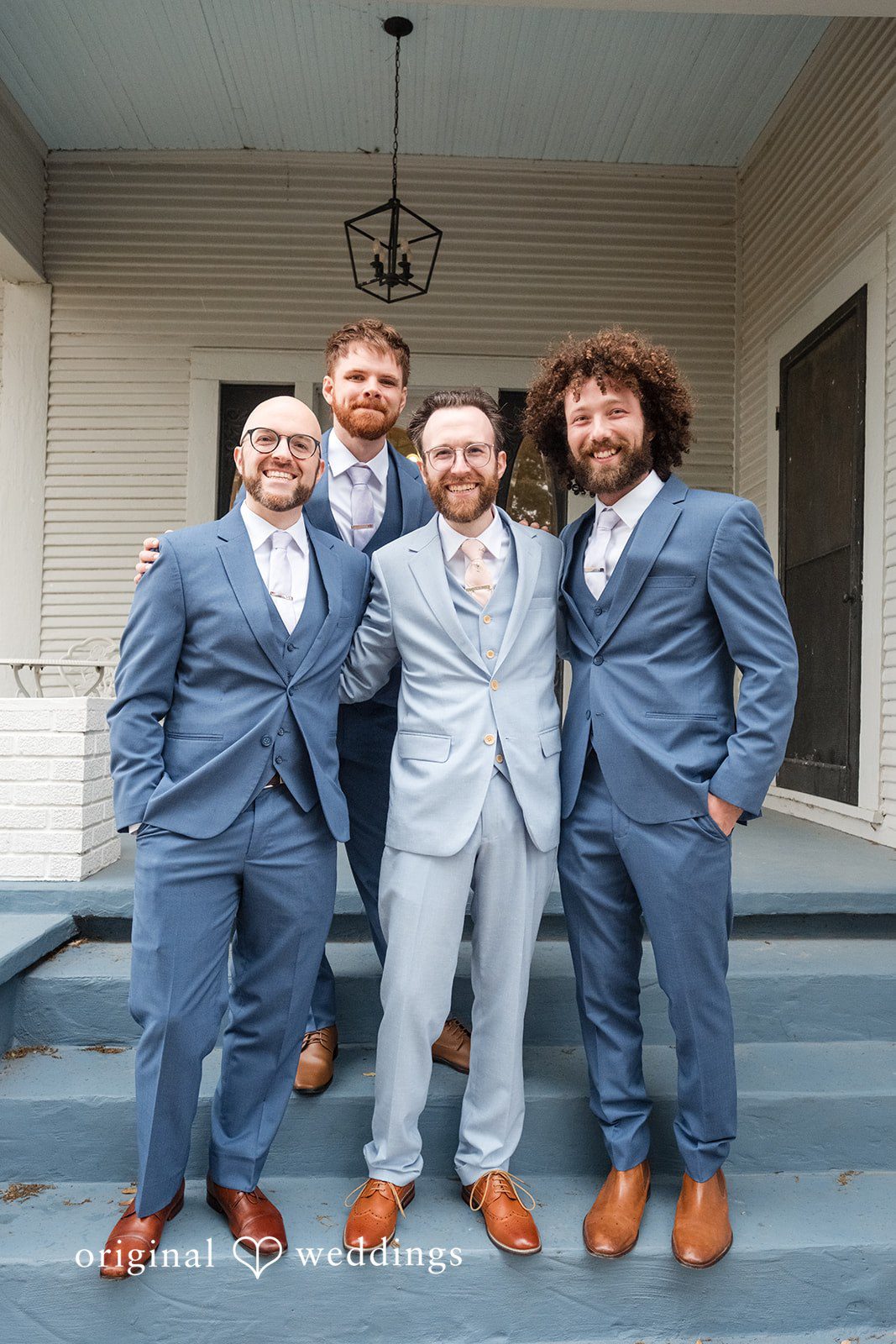 Dana + Daniel Groom with groomsmen in a celebratory wedding party moment