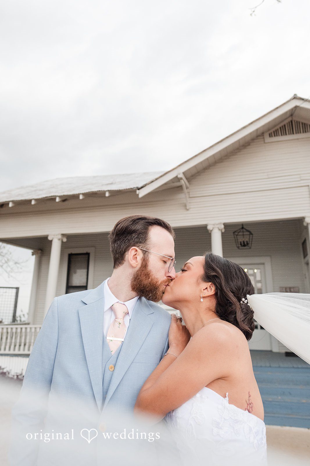 Dana + Daniel Bride and groom sharing a romantic kiss