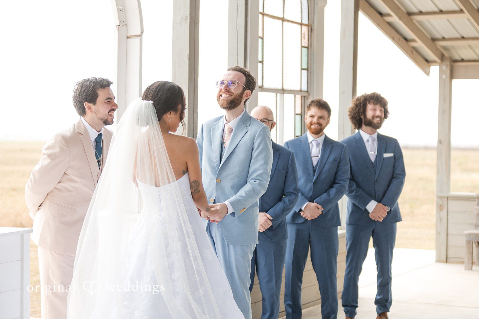 Dana + Daniel Bride and groom holding hands during the wedding ceremony