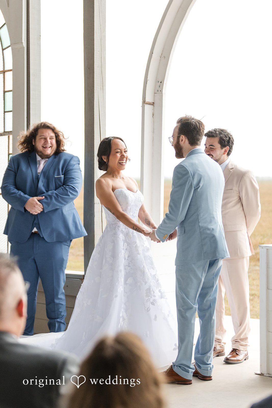 Dana + Daniel Bride and groom smiling during the ceremony