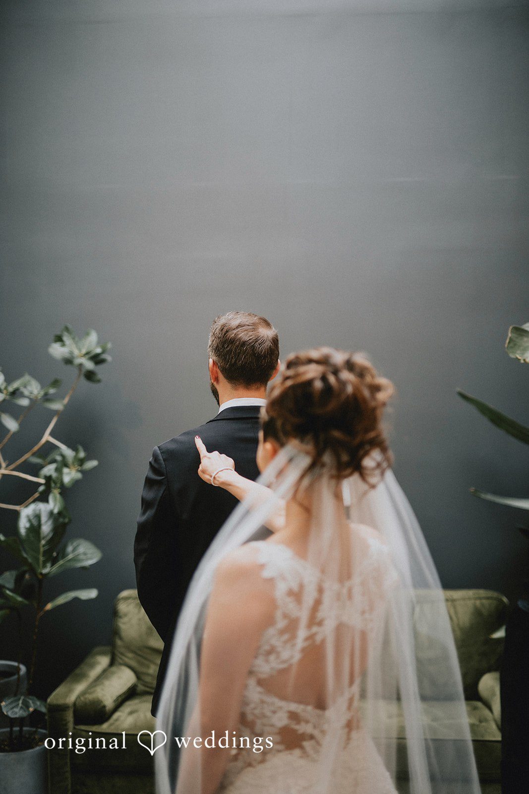 The bride about to unveil herself to the groom