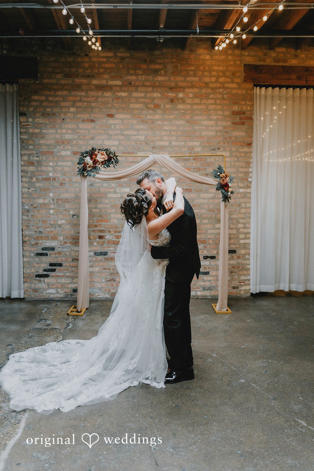 The couple takes their first kiss