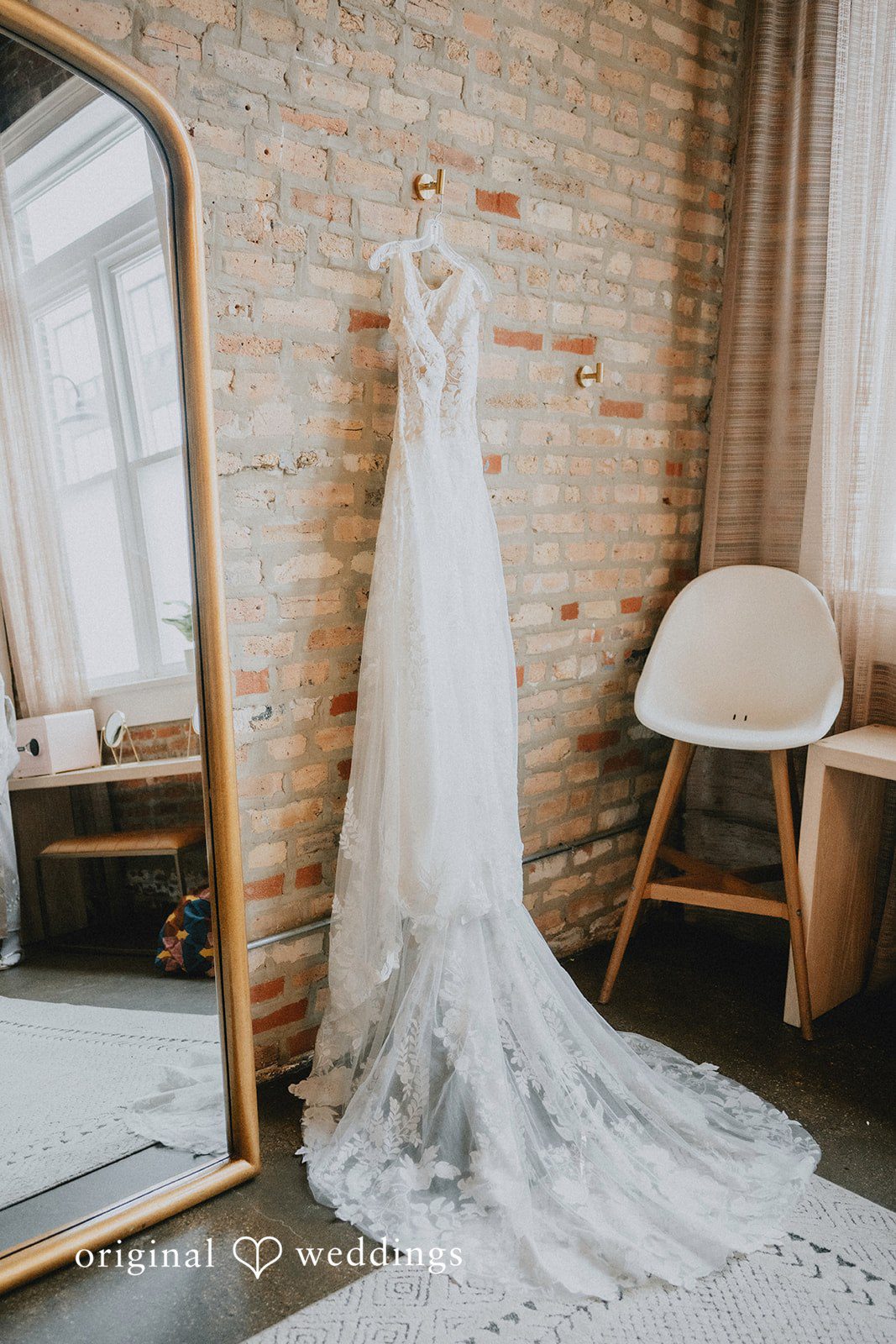 The bride's gown gracefully hanging at the Bridal suite